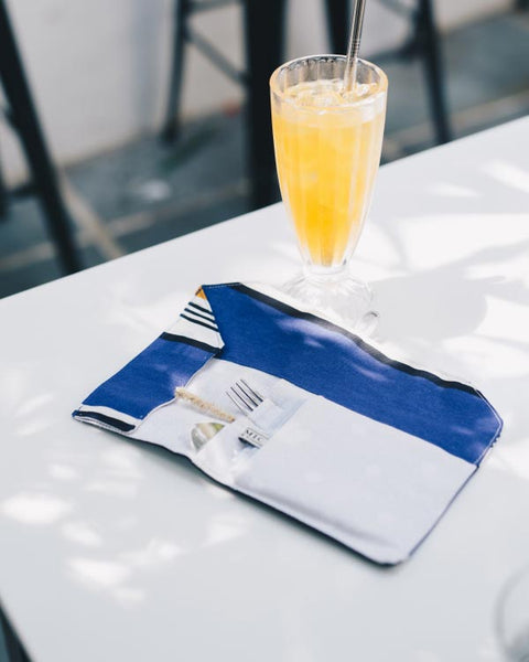 Reusable Fab Array Travel Cutlery Set NZ – stainless steel spoon, fork, knife, chopsticks, straw, napkin and straw cleaner in a fabric pouch.