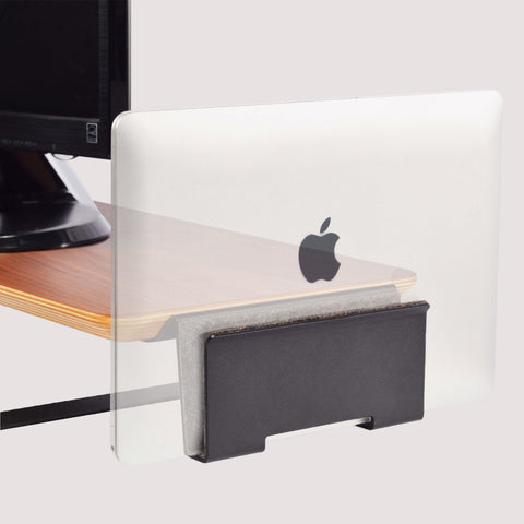 A laptop docked vertically on the Elevate Pro Monitor Stand, saving desk space.